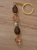 Beaded Keychain - Warm Amber, Rose Gold, with a centered Golden Cross